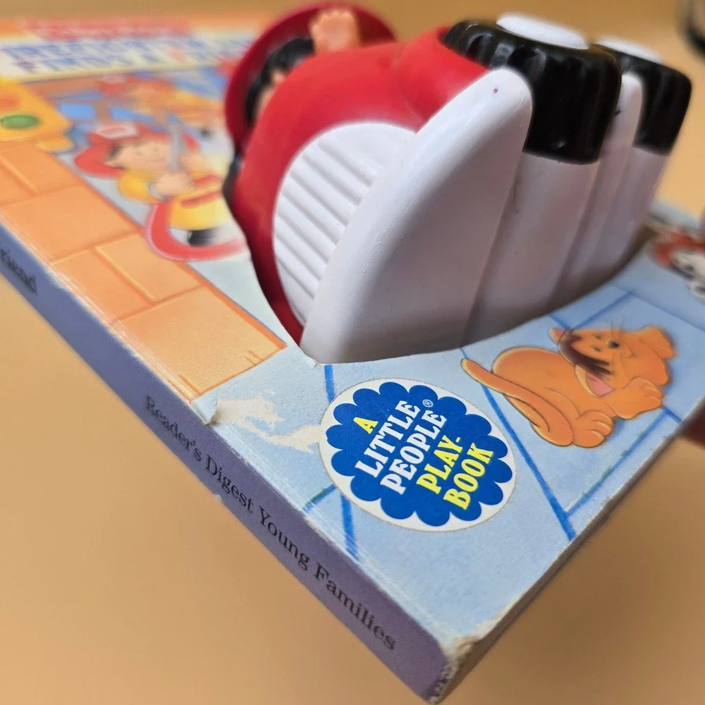 Fisher-Price Little People Firefighter Sam Finds a Friend Board Book Toy 1997